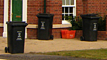 Wheelie bins and orange recycling boxes